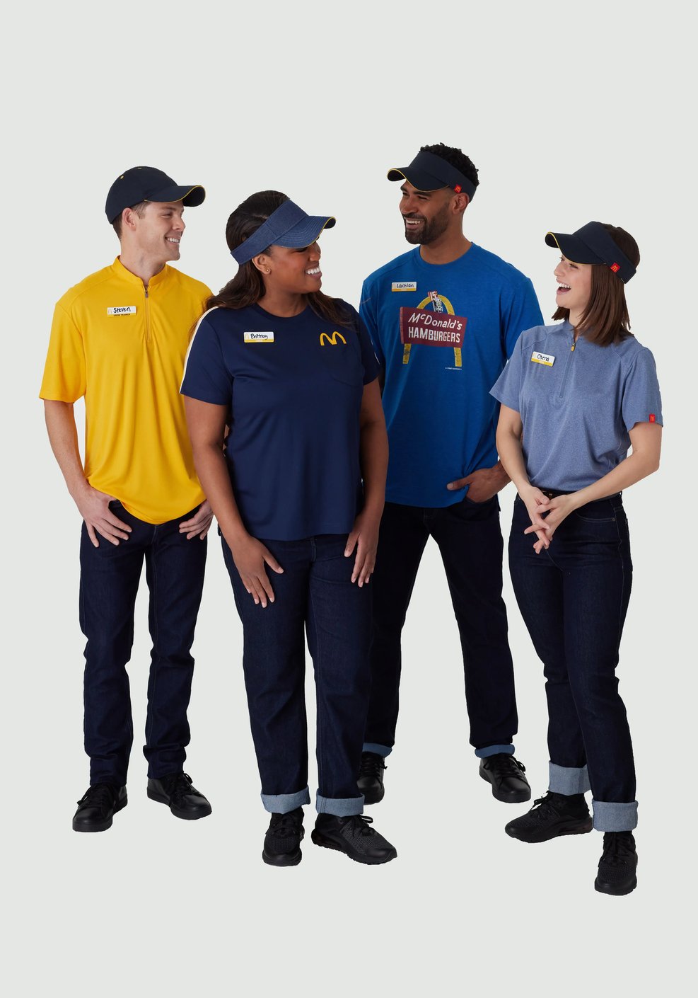 McDonald's employees wearing branded jeans and various uniform shirts.