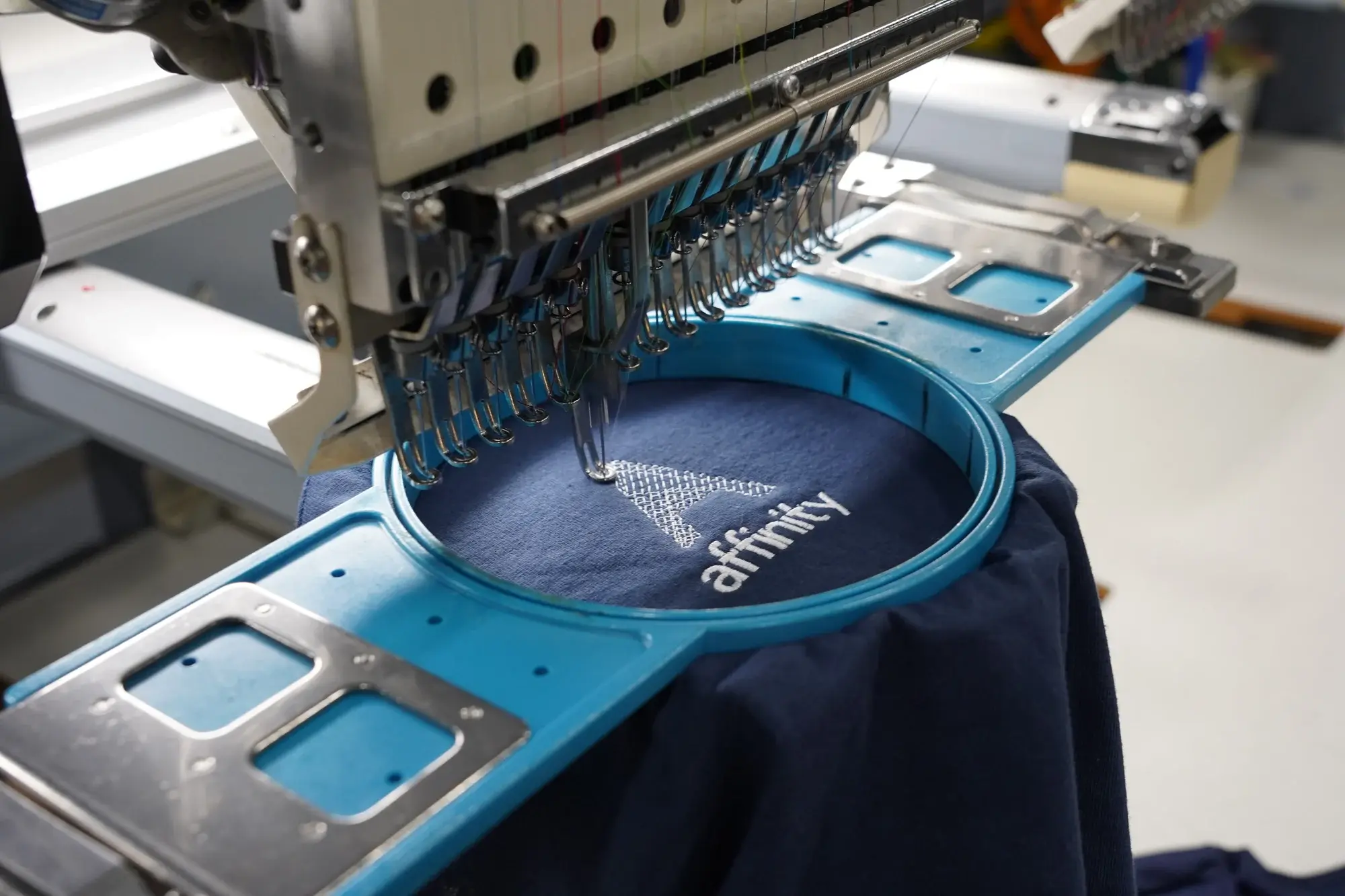 Logo being embroidered